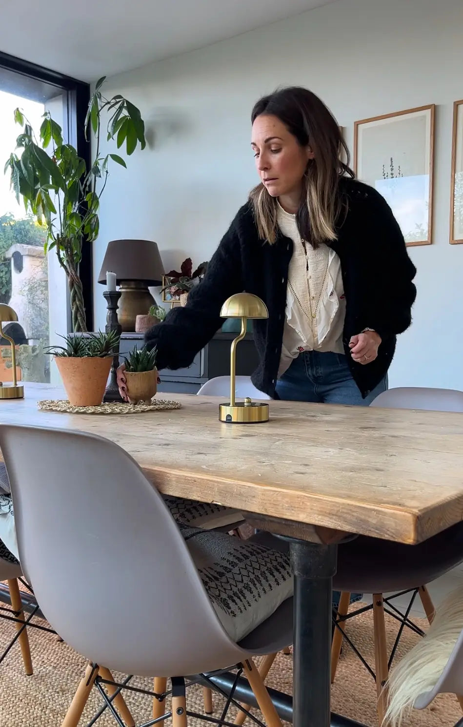 Lucy, the lead interior designer, styling a dining room table in a Victorian property.