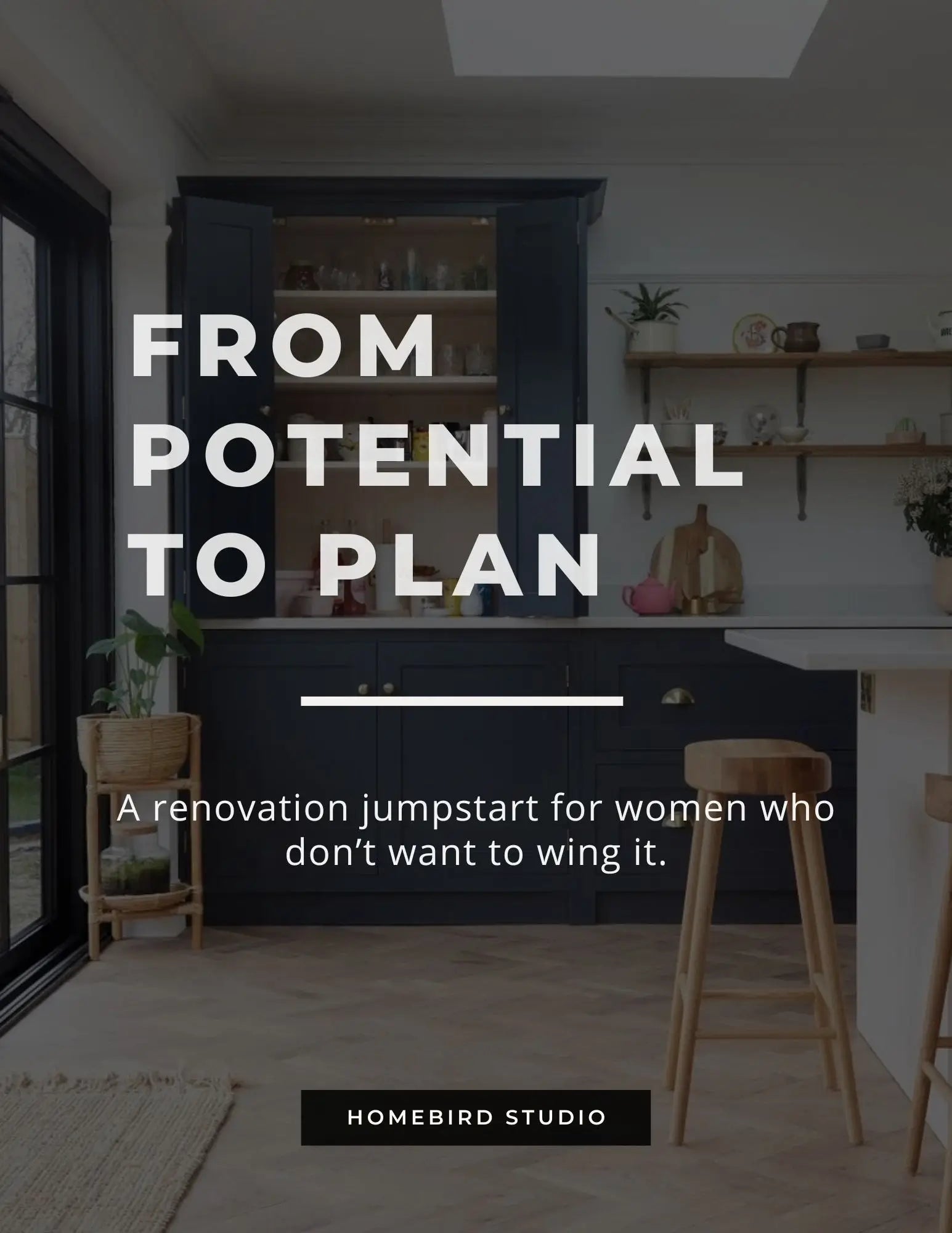 Elegant kitchen with navy cabinets and herringbone floor — renovation planning service for women
