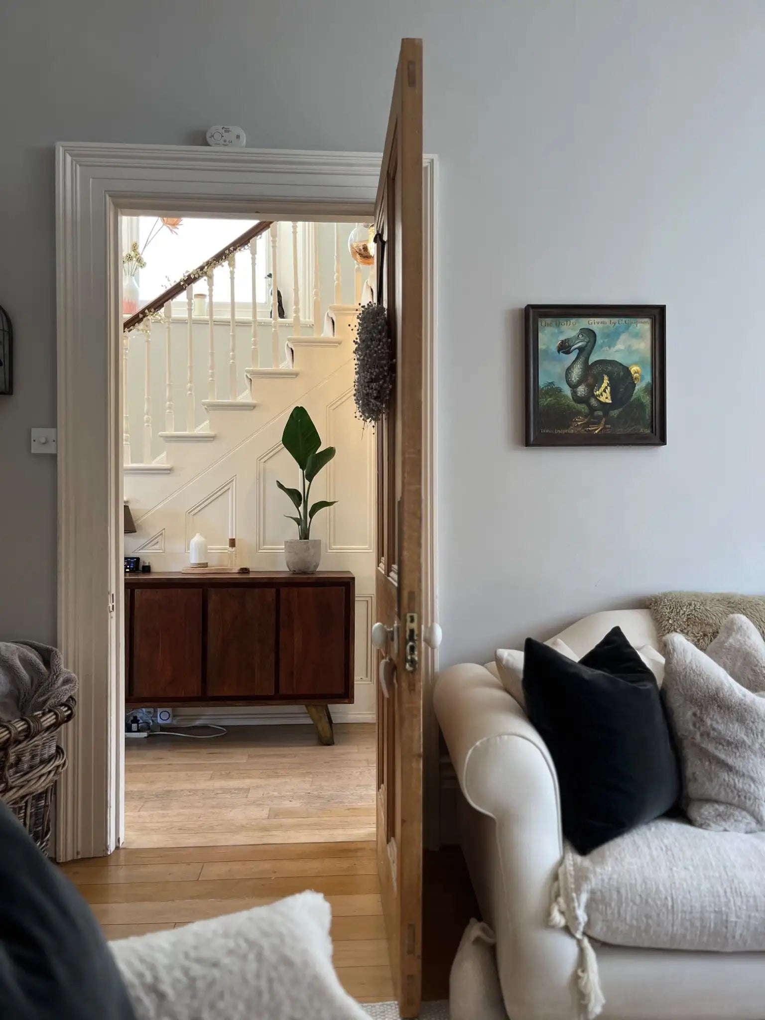 View from the Victorian living room through to the hallway with a beautiful mid-century console 